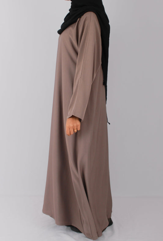 Hijabi wearing essential everyday abaya in lilac grey with black hijab