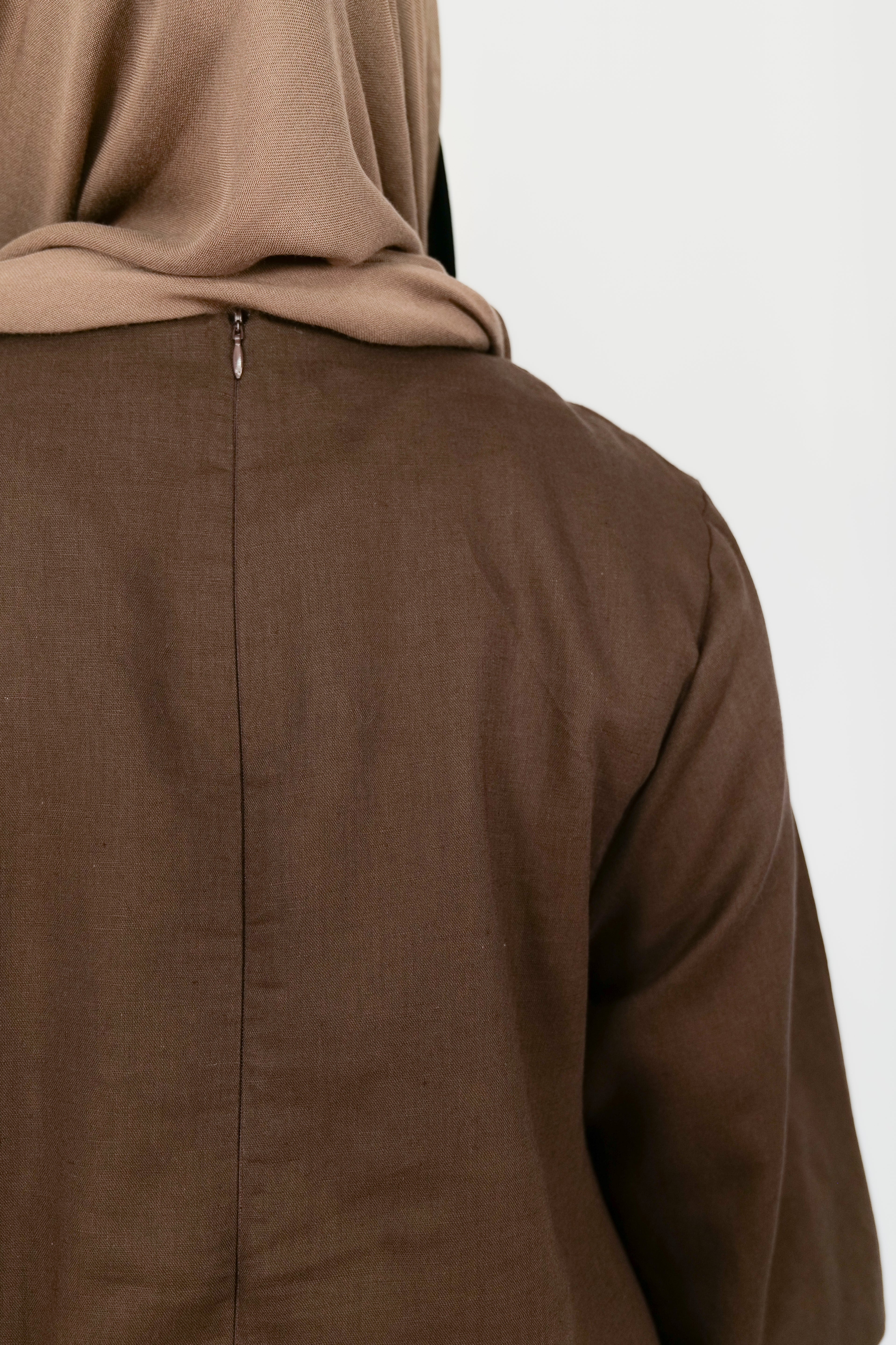 Brown abaya with a hood on a white background